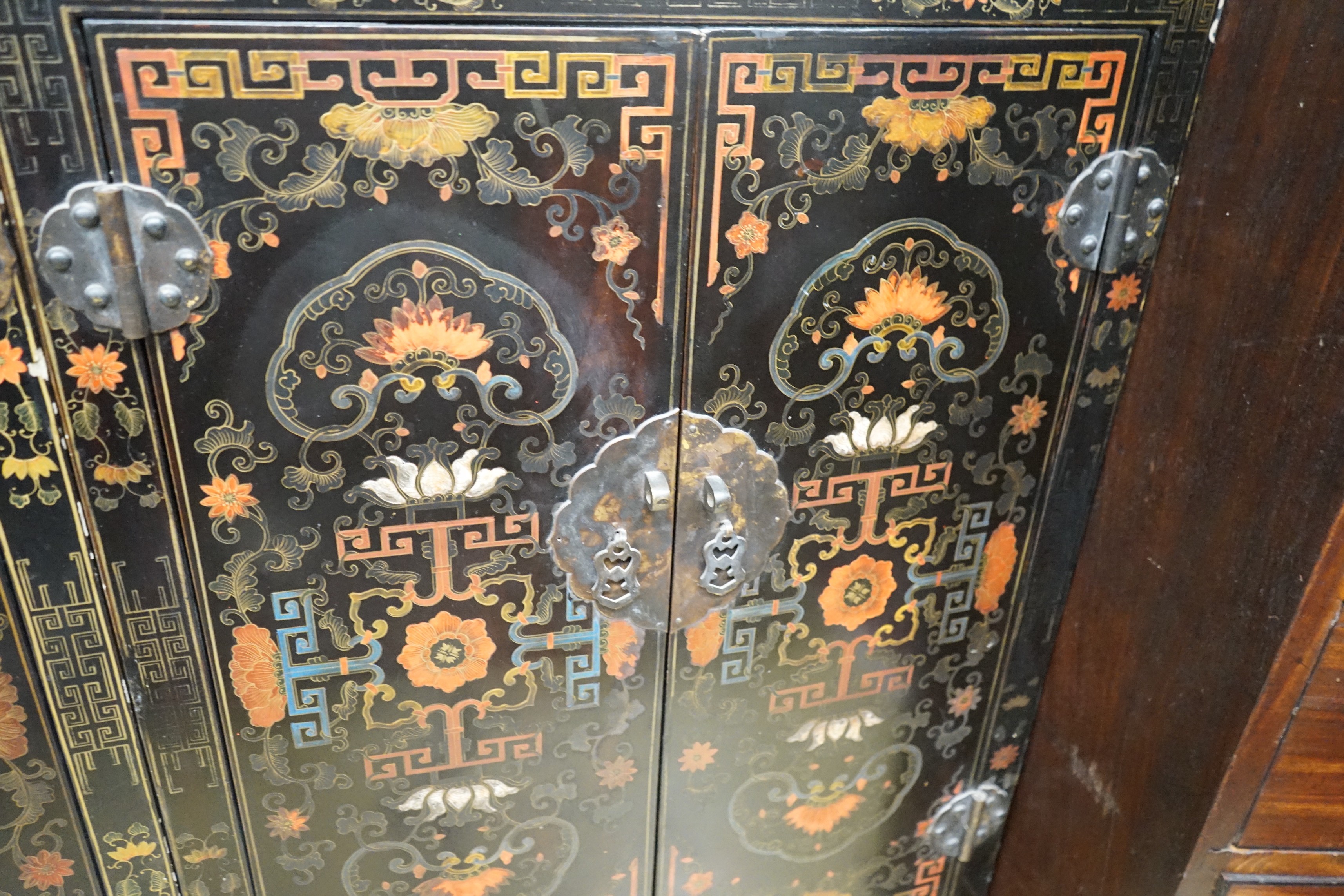 A pair of Chinese painted two door side cabinets, width 61cm, depth 31cm, height 93cm